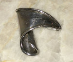 Sterling silver pin by artist George Salo
