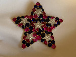 Signed Joan Rivers brooch, pink/red blue clear crystal star gold tone