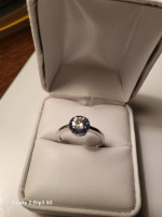 White and blue sapphire halo ring