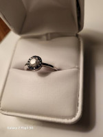 White and blue sapphire halo ring