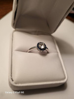 White and blue sapphire halo ring
