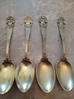 4 gold over sterling silver spoons . antique