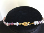 Long purple and white pearl necklace
