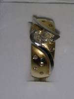 One 14 karat yellow gold ring with flush setting pear shaped diamond