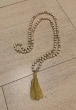 Long beaded decorative necklace with tassel