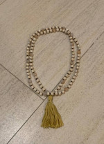 Long beaded decorative necklace with tassel