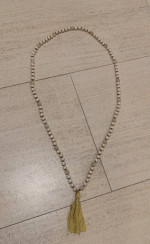 Long beaded decorative necklace with tassel