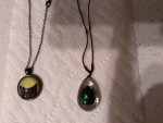 (2) necklaces with cat and beetle