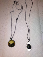 (2) necklaces with cat and beetle