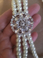 three strand faux white pearls with attached rhinestone detail faux br