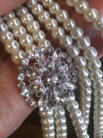 three strand faux white pearls with attached rhinestone detail faux br