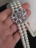 three strand faux white pearls with attached rhinestone detail faux br