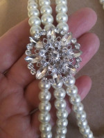 three strand faux white pearls with attached rhinestone detail faux br