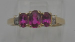 10KT YELLOW GOLD RING SIZE 7.25 2.2 GRAMS 3 RED STONES 4 DIAMONDS MINT
