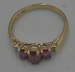 10KT YELLOW GOLD RING SIZE 7.25 2.2 GRAMS 3 RED STONES 4 DIAMONDS MINT