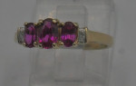 10KT YELLOW GOLD RING SIZE 7.25 2.2 GRAMS 3 RED STONES 4 DIAMONDS MINT