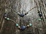 Women's longer decorative chain necklace with two shades of blue beads