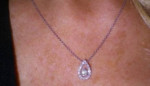 Leo Round cut diamond pear shaped necklace. 14kWG. 1/2ct.