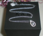 Leo Round cut diamond pear shaped necklace. 14kWG. 1/2ct.