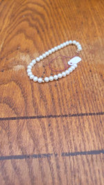 Pearl bracelet with gold ball