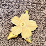 Ivory flower brooch with gold nugget.