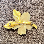 Ivory flower brooch with gold nugget.