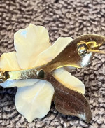 Ivory flower brooch with gold nugget.