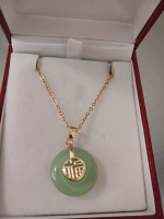 LADY'S FAUX CIRCULAR JADE PENDANT W/GOLD PLATED ORIENTAL SYMBOL