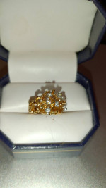 Marked gold cluster ring