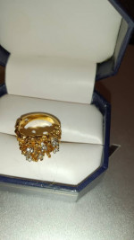 Marked gold cluster ring
