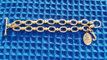 JUICY COUTURE GOLD-TONE HEART AND LOGO CHARM BRACELET