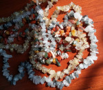 necklace: three rows of rock beads