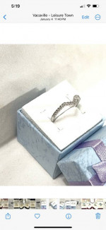 Brand new 17 authentic diamonds set in a solid silver prom ring. Size 7.