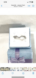 Brand new 17 authentic diamonds set in a solid silver prom ring. Size 7.