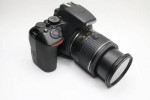 Nikon D3500 Digital Camera With a Lens and lens filter.