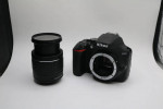 Nikon D3500 Digital Camera With a Lens and lens filter.