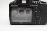 Nikon D3500 Digital Camera With a Lens and lens filter.