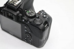 Nikon D3500 Digital Camera With a Lens and lens filter.