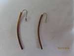 7 gold tone dangly earrings and 1 necklace