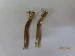 7 gold tone dangly earrings and 1 necklace