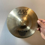 Assortment used cymbal stands in gig bag with wheels