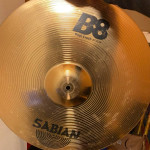 Assortment used cymbal stands in gig bag with wheels