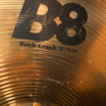 Assortment used cymbal stands in gig bag with wheels