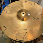 Assortment used cymbal stands in gig bag with wheels