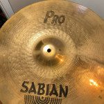 Assortment used cymbal stands in gig bag with wheels