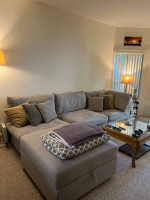 Gray Crate & Barrel sectional sofa with storage ottoman
