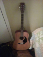 Guitar, guitar stand and extra strings