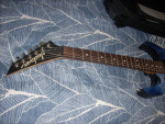 Jackson goth crows reverse headstock guitar with gig bag.