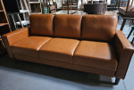 Sleek caramel sofa