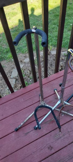 Four old guitar stands